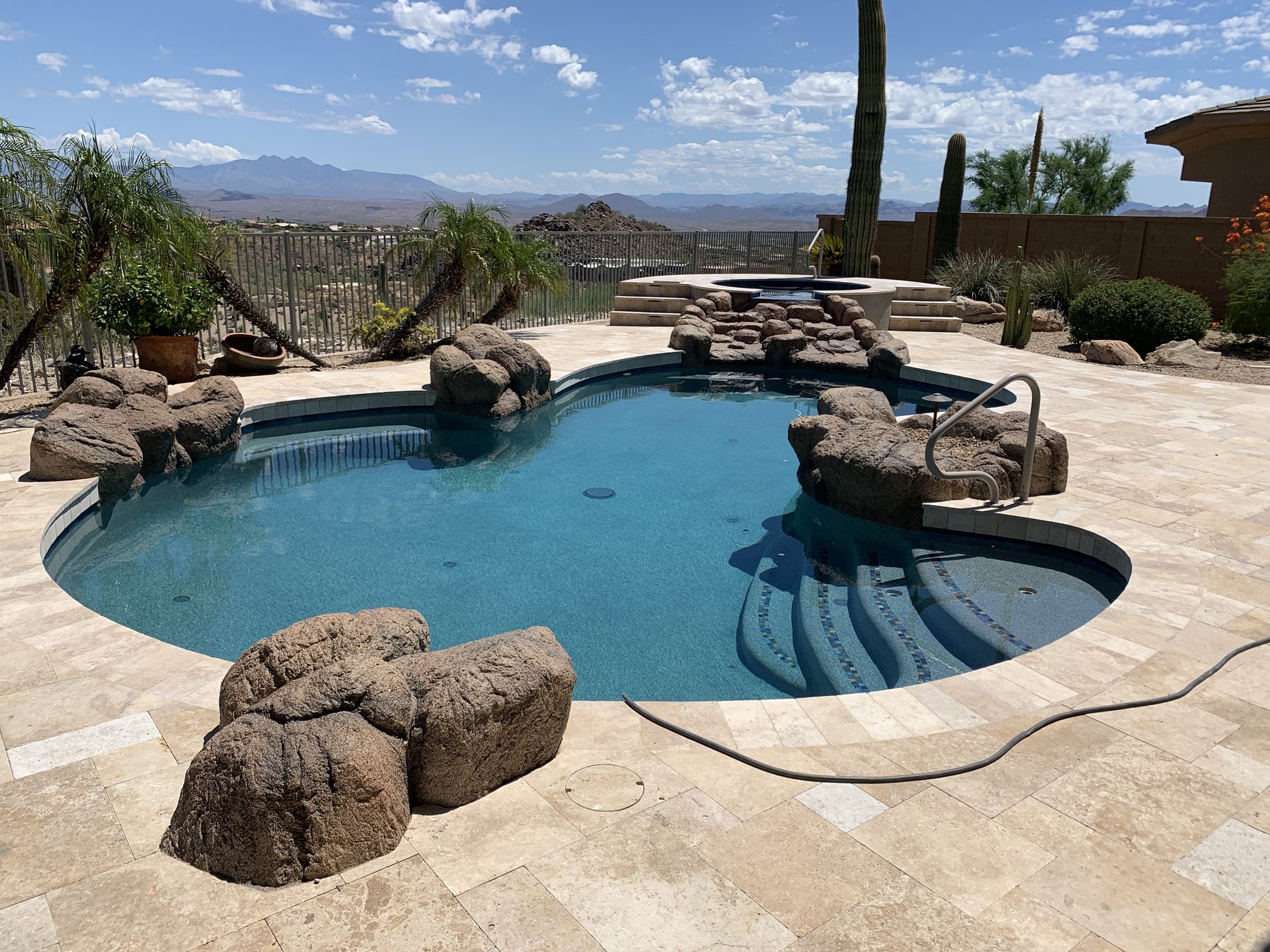 Freeform pool with rock waterfall and grotto — Standard Pools project