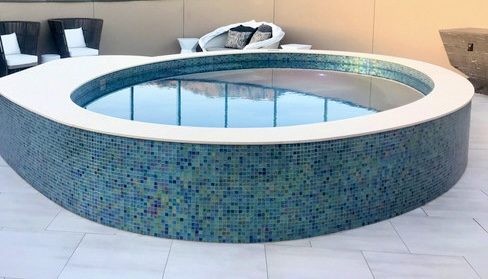 Round stand-alone glass-tile spa